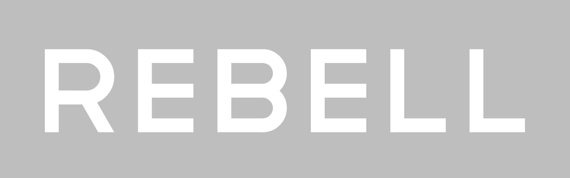 Texten Rebell p&aring; gr&aring; bakgrund