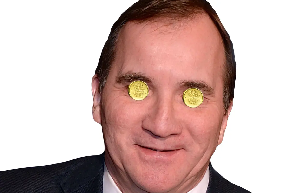 Stefan L&ouml;fven med guldmynt f&ouml;r &ouml;gonen